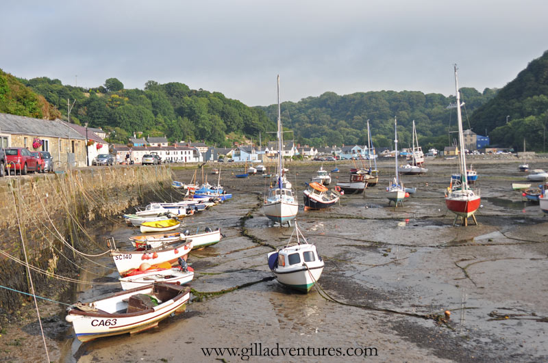 The tide's out in the Lower Town, Fishguard harbor. At low tide, the boats rest on the sand, floating again as the tide rises.